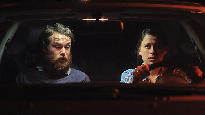 A still from the Finale: Ethan and Kate driving in the middle of the night